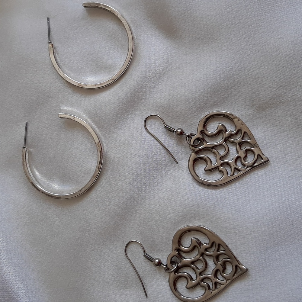 Silver toned earrings for pierced ears. 2 pairs.